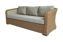 Load image into Gallery viewer, A tropical wicker sofa with beige cushions and a sturdy structure, designed for outdoor use.