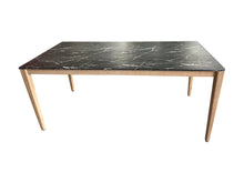 Load image into Gallery viewer, Dining table with black marble top and wooden legs on a white background