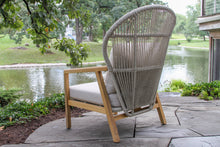 Load image into Gallery viewer, Cable Wicker with wooden frame chair on a patio