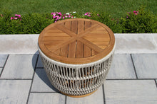 Load image into Gallery viewer, Wooden outdoor table with wicker base on a patio