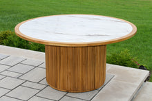 Load image into Gallery viewer, Round wooden table with a white marble top on a patio
