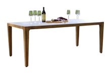 Load image into Gallery viewer, Dining table with wine glasses, bottle, and food