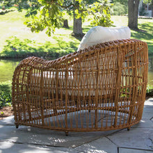Load image into Gallery viewer, Wicker outdoor chair with white cushions on a patio