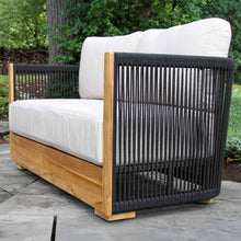 Load image into Gallery viewer, Outdoor love seat with black woven backrest and wooden frame on a patio