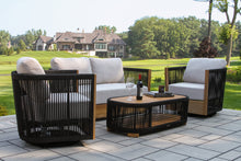 Load image into Gallery viewer, Outdoor patio furniture set with black and beige chairs and a round table on a patio.