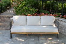 Load image into Gallery viewer, Outdoor sofa with white cushions on a patio area