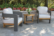 Load image into Gallery viewer, Outdoor patio set with two chairs and a small table on a stone patio.