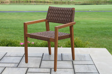Load image into Gallery viewer, Brown outdoor chair on a patio with grass and flowers in the background
