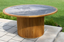 Load image into Gallery viewer, Round wooden table with a stone top on a patio

