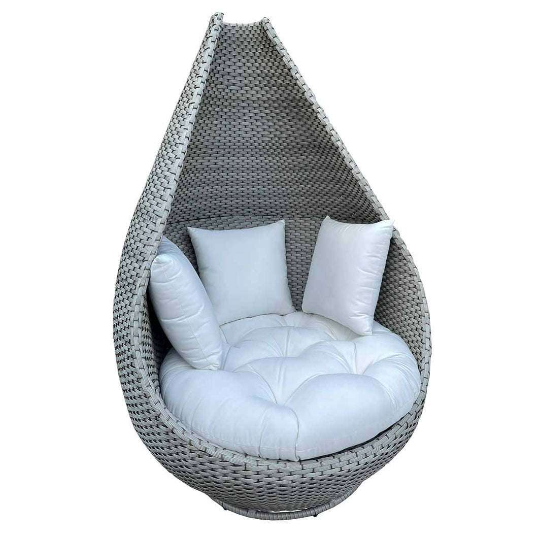 Wicker egg-shaped chair with white cushions