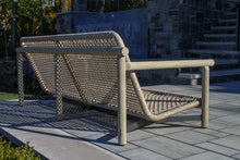 Load image into Gallery viewer, Outdoor sofa on a patio with a blurred background
