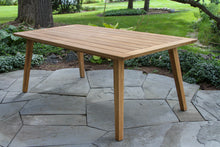 Load image into Gallery viewer, Wooden outdoor dining table on a stone patio
