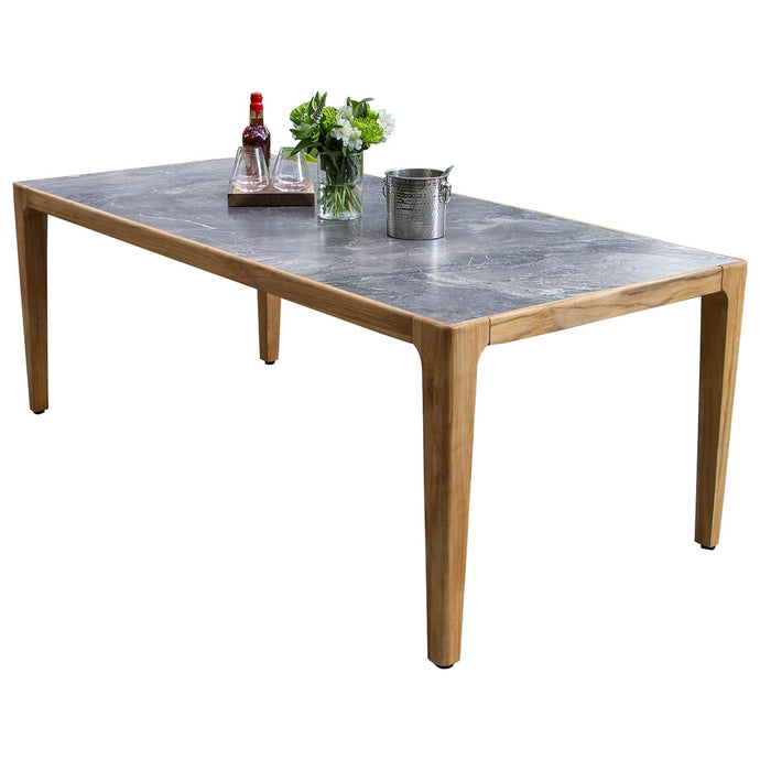 Dining table with a gray marble top and wooden legs