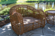 Load image into Gallery viewer, Wicker outdoor furniture set by a pond
