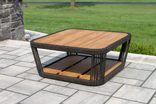 Load image into Gallery viewer, Wooden outdoor coffee table with wicker frame on a patio
