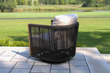 Load image into Gallery viewer, Black outdoor chair with a cushion on a patio
