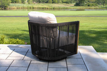Load image into Gallery viewer, Black rope wicker chair with white cushion on a patio
