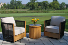 Load image into Gallery viewer, Outdoor patio set with two swivel chairs and a table on a patio area
