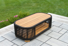 Load image into Gallery viewer, Wooden coffee table with black wicker on a patio
