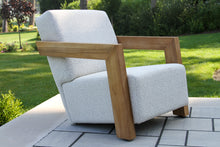 Load image into Gallery viewer, White armchair with wooden frame on a patio
