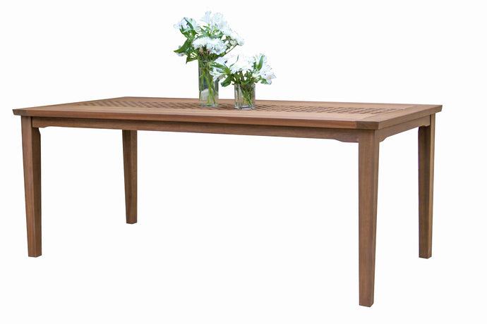 An oversized checkerboard table made of wood with stainless steel hardware, featuring a checkerboard accent runner and umbrella hole. It is set outdoors and has a vase with flowers on top.